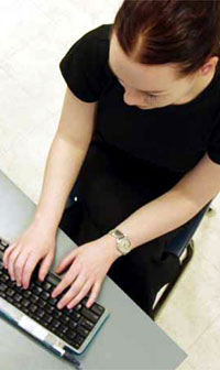 student_with_mac_typing